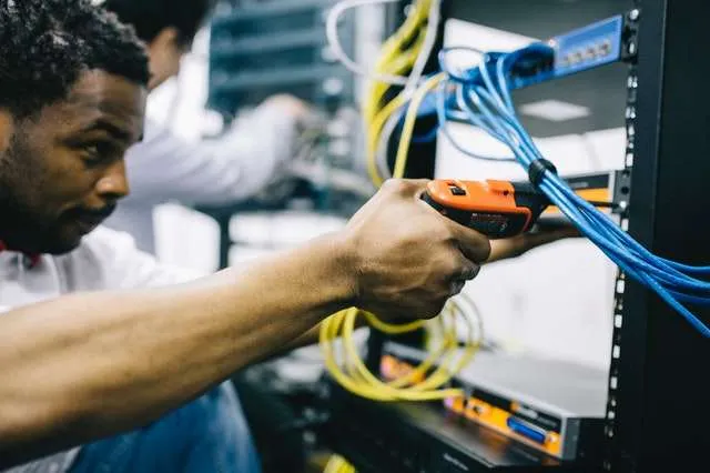 Cloud-enabled automation for all processes A person setting up a server rack